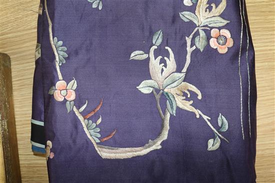 A Chinese silk embroidered panel, worked with figures, dragons and peonies, on a purple ground